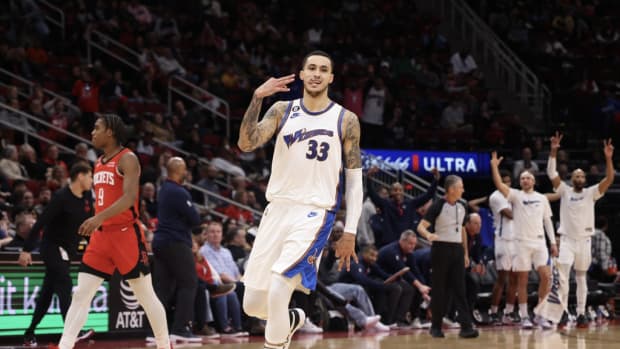 Washington Wizards forward Kyle Kuzma (33) celebrates his three point basket against the Houston Rockets in the fourth quarter at Toyota Center.